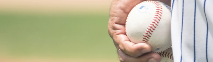 person holding baseball