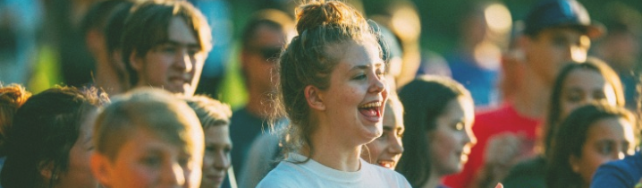 girl in larger crowd of people